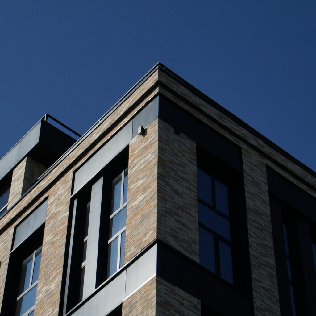 Low angle view of a modern building facade with brick and glass in Kyiv.